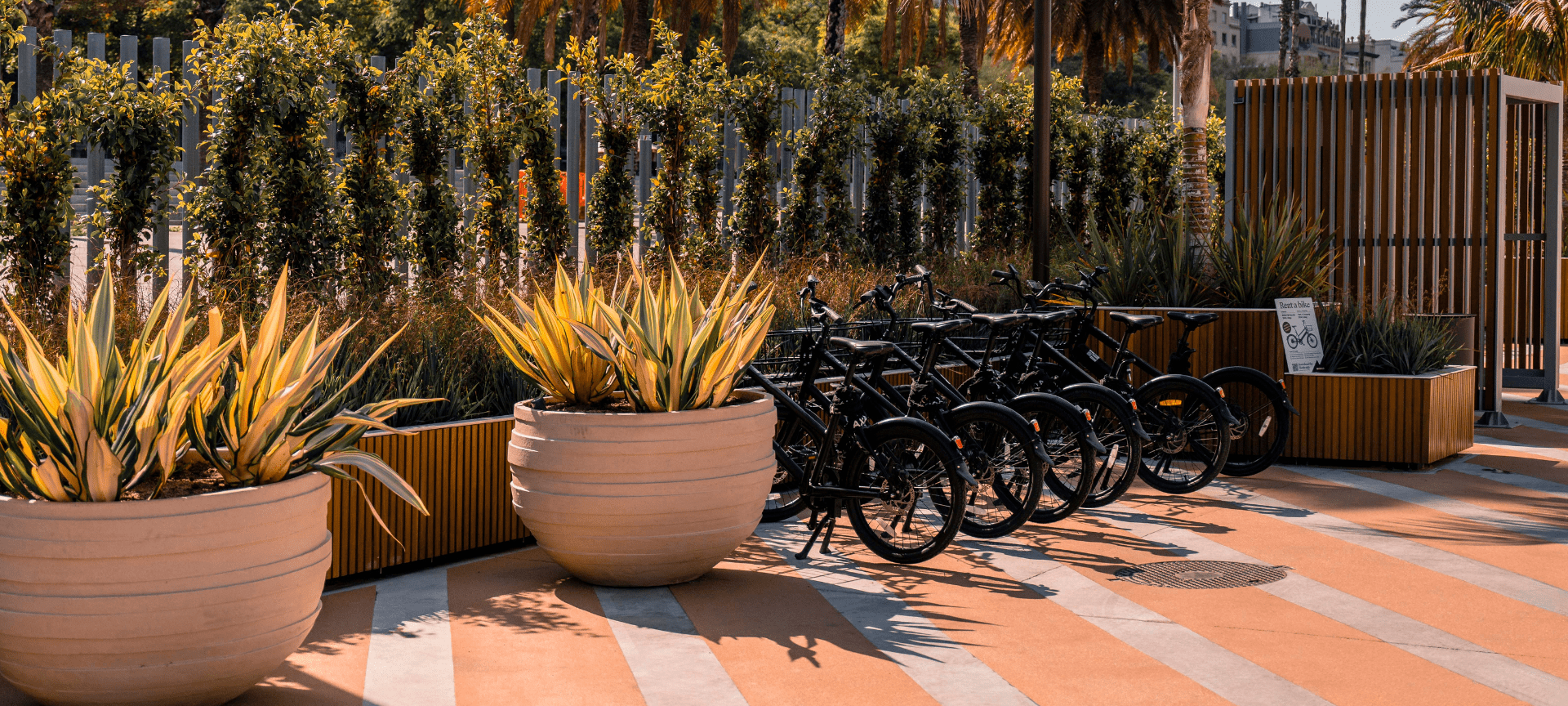 Green spaces and bike parking at Marina Port Vell.