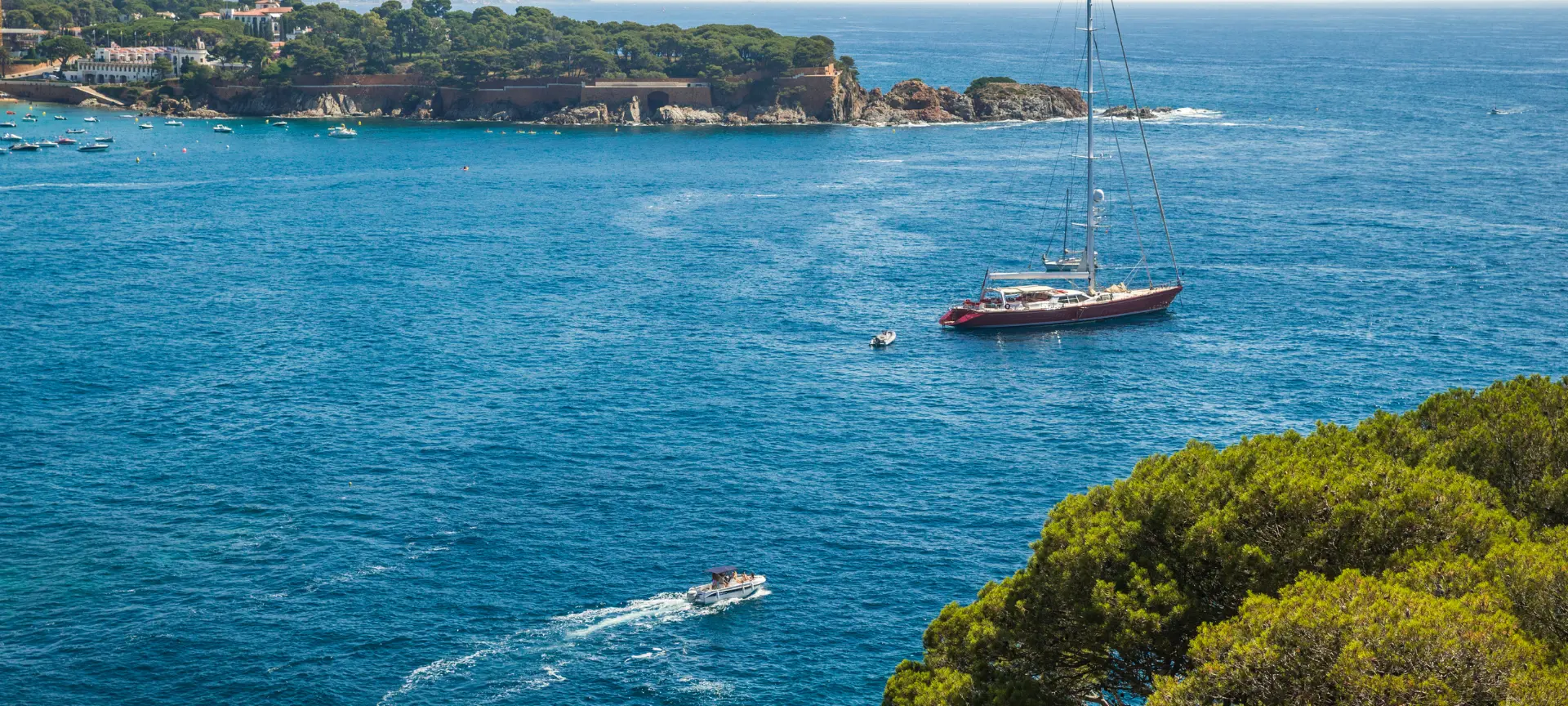 View of the Mediterranean Sea from the Costa Brava, near Marina Port Vell; a peaceful landscape inviting exploration of secluded coves and quiet corners by water